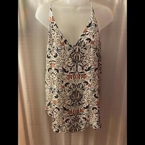 White Floral top. (white with blues and red)
Brand Loft
Size Medium